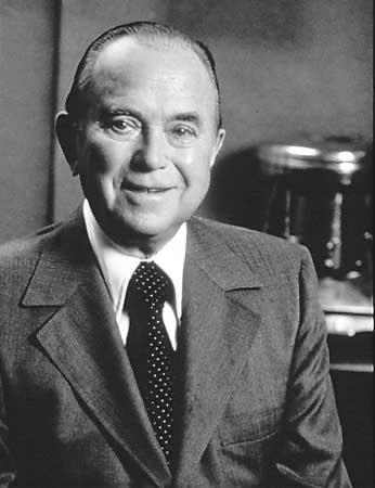 Ray Kroc stands for a picture