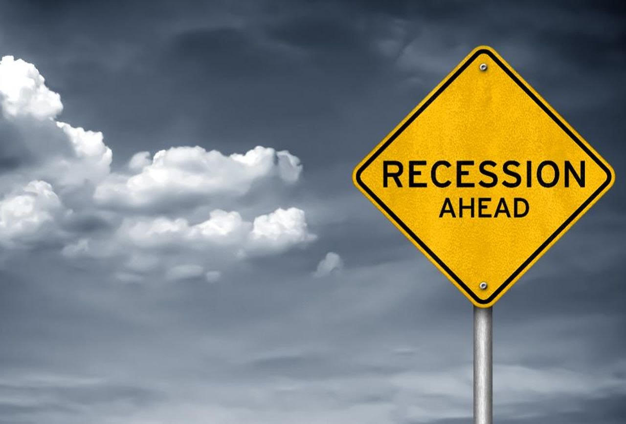 A sign saying 'recession ahead' in reference to the recession in 2020 we will see