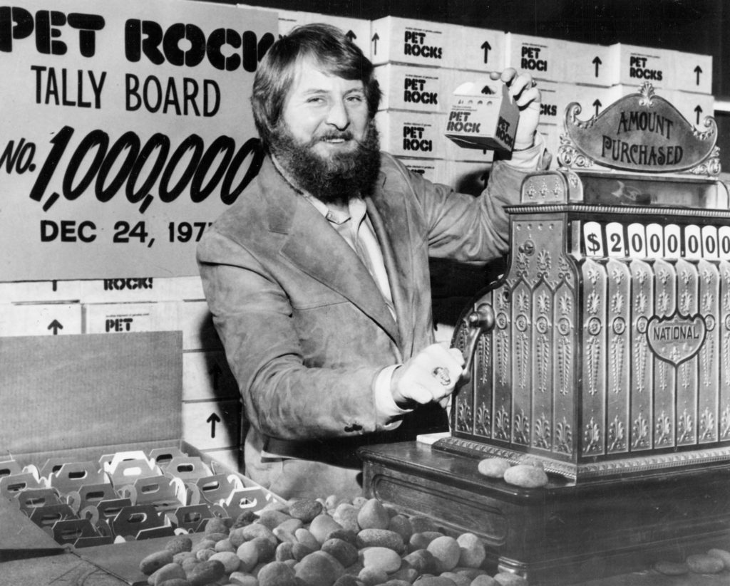 Gary Dahl stands at a photoshoot holding his infamous pet rock