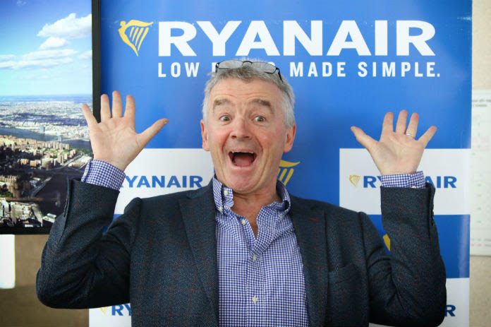 Lessons from Michael O'Leary: Michael O'Leary looks surprised in front of the Ryanair logo