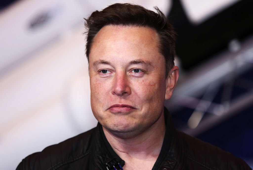 Richest businessmen: Elon Musk stood staring into the camera with an unhappy look